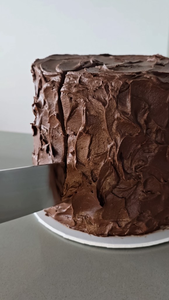 Chocolate cake having a slice cut out