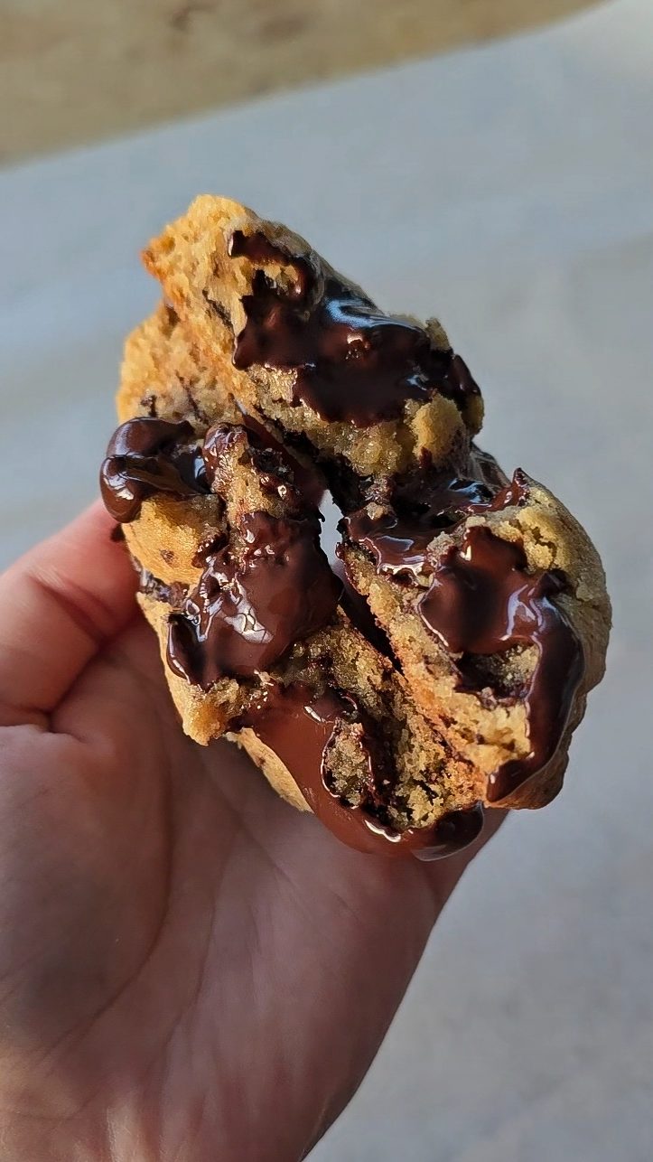 Inside of a chocolate chip cookie melting chocolate
