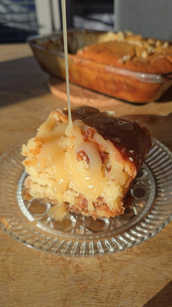 slice of honey cake with glaze dripping in sunlight